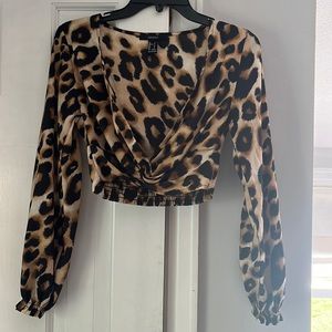 Cheetah print going out shirt. Cross in front. Ruffle sleeves.